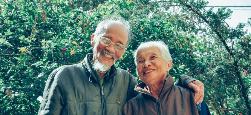 smiling man and woman wearing jackets