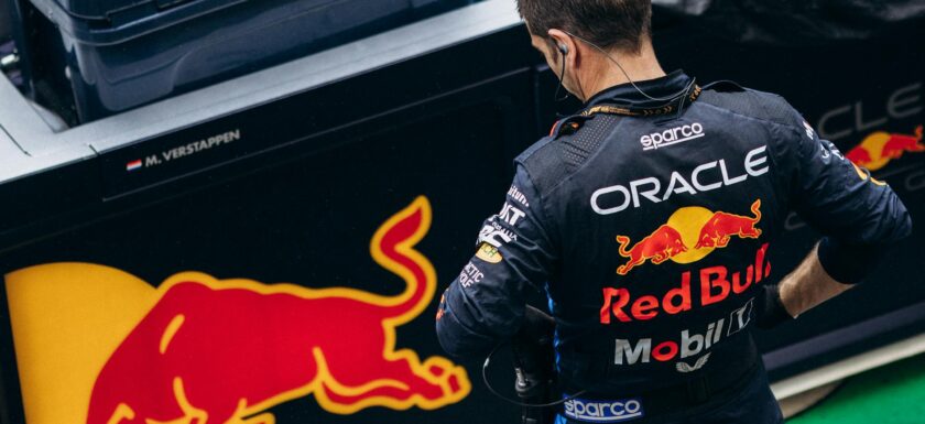 Red Bull crew member looking at Red Bull logo
