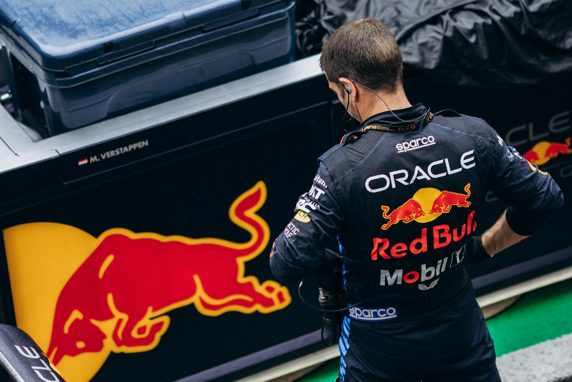 Red Bull crew member looking at Red Bull logo